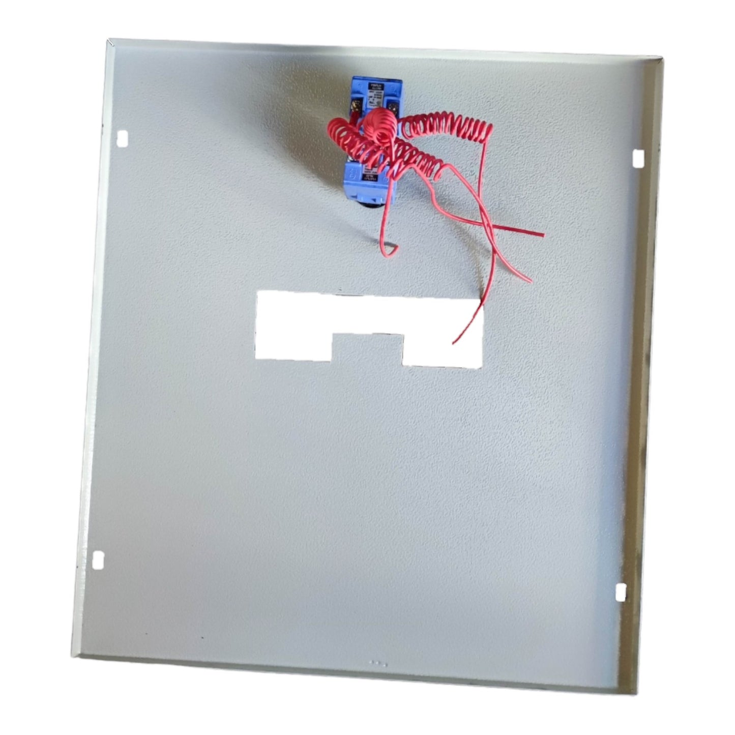 Rectangular metal plate with a small electronic component and red wires on a white background