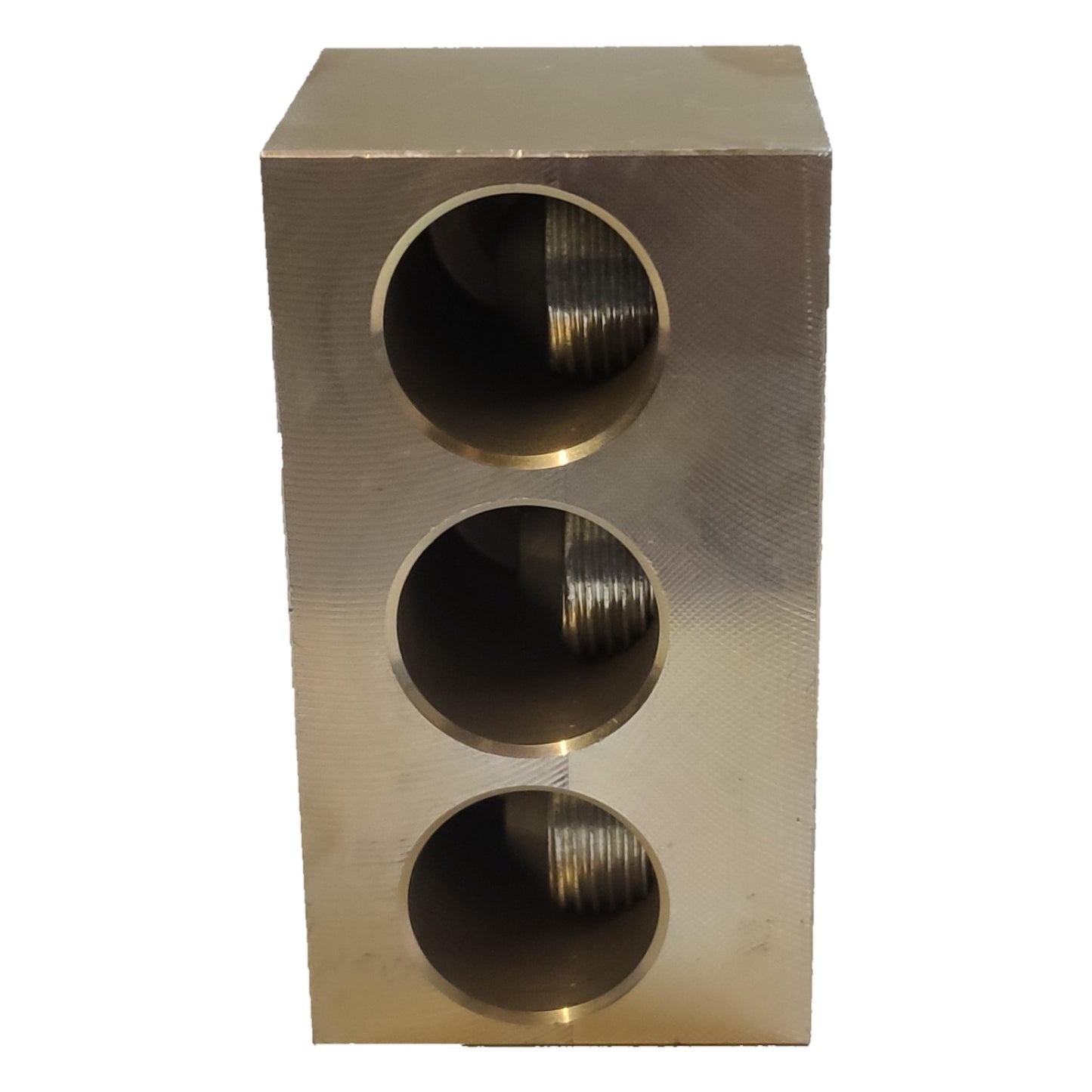 Metallic block with three circular holes on a white background