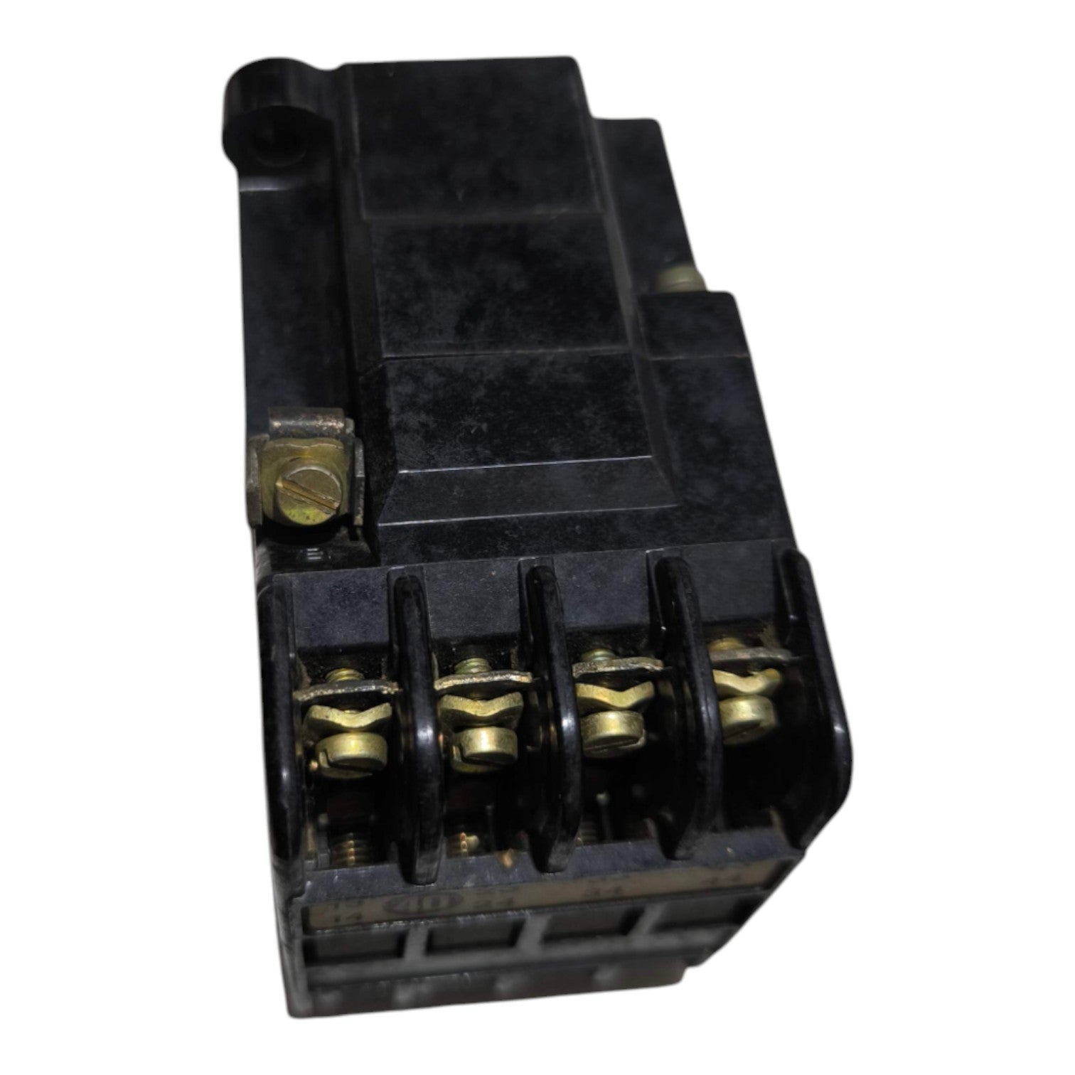 A black plastic electrical relay or terminal block with four brass screw terminals, shown on a plain white background.
