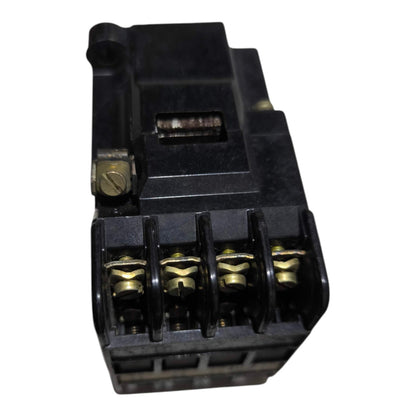 A black plastic electrical terminal block connector with four gold-colored screw terminals, shown on a plain white background.
