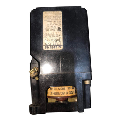 A Siemens electrical contactor or relay component with a black plastic housing, brass terminal hardware, and a yellow specification label, shown against a plain white background.