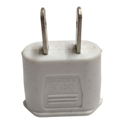 A white plastic 6A 250V Sugimoto wall plug adapter with two metal pins, shown against a plain white background.