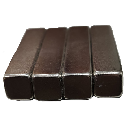 Four rectangular metal magnets on a white background