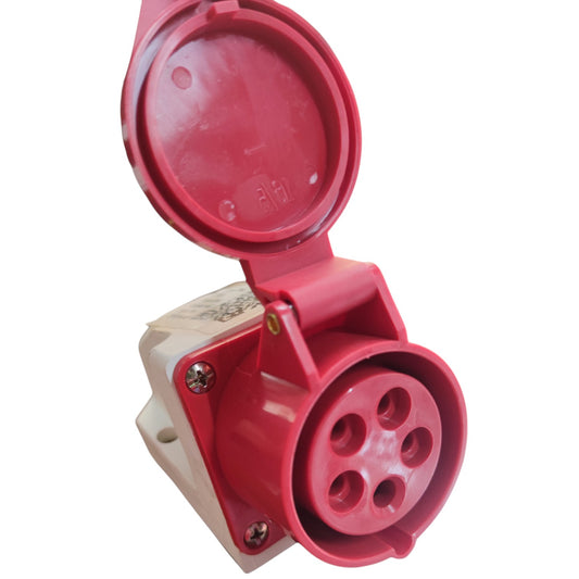 A red 4-pin industrial electrical outlet socket with an open hinged protective cover, mounted on a beige plastic base.