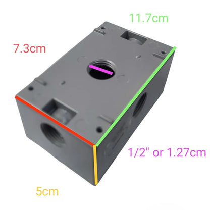 A gray plastic electrical junction box shown on a white background with colored dimension lines and text indicating measurements: 11.7cm, 7.