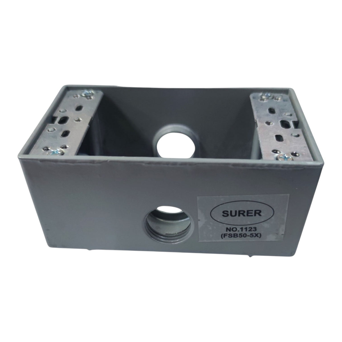 A gray metal electrical junction box with mounting slots on the top and a visible SURER brand label on the front, isolated on a white background.
