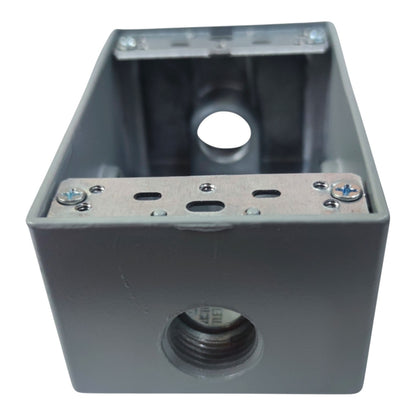 A gray metal electrical junction box with threaded pipe connectors on the front and top, secured with screws, shown on a white background.