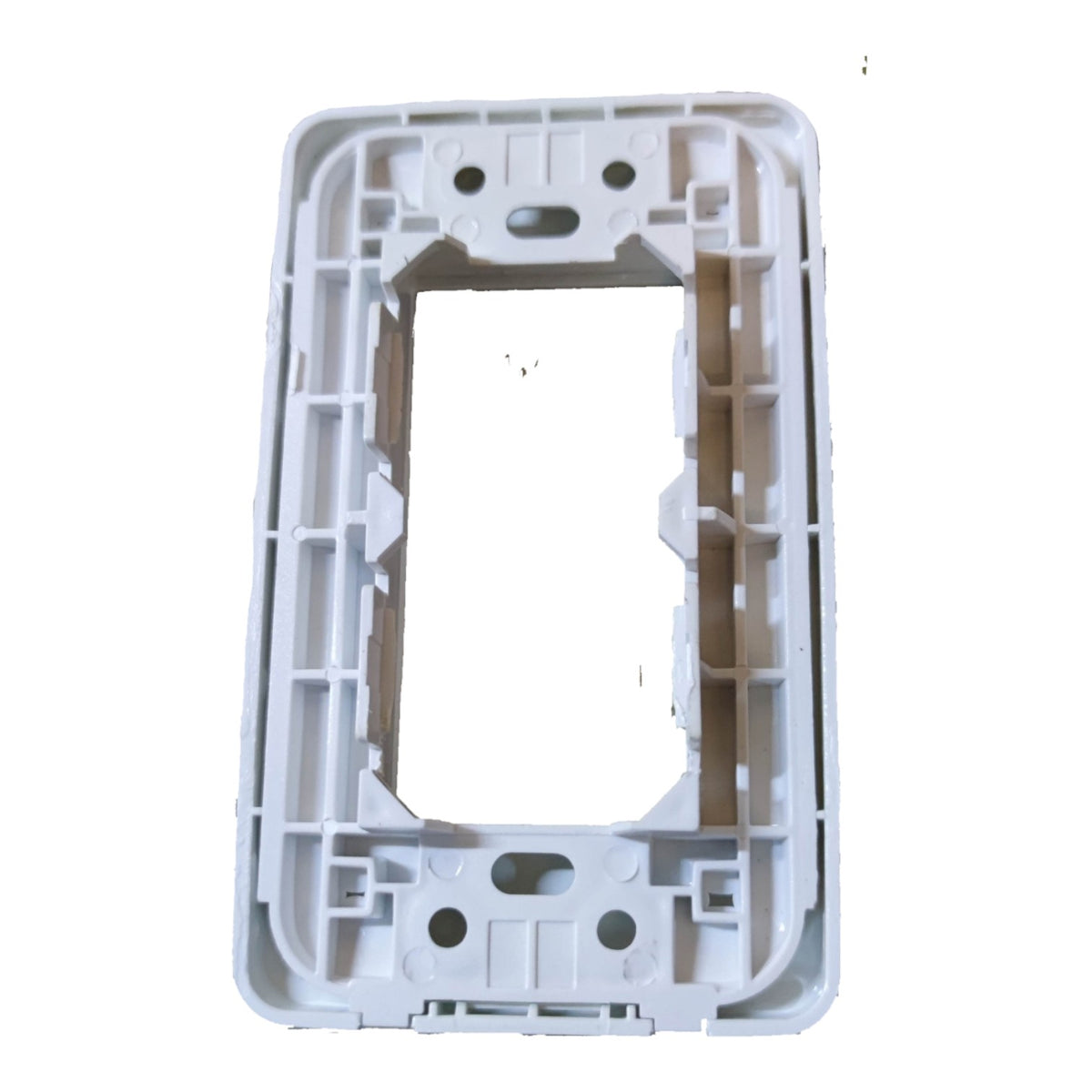 A white plastic electrical outlet cover plate frame, shown from a top-down perspective on a white background.