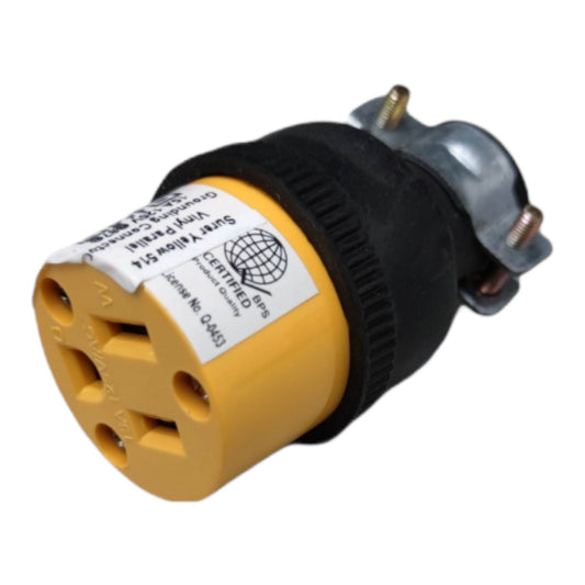 A yellow and black electrical outlet adapter with a white safety label, photographed on a plain white background.