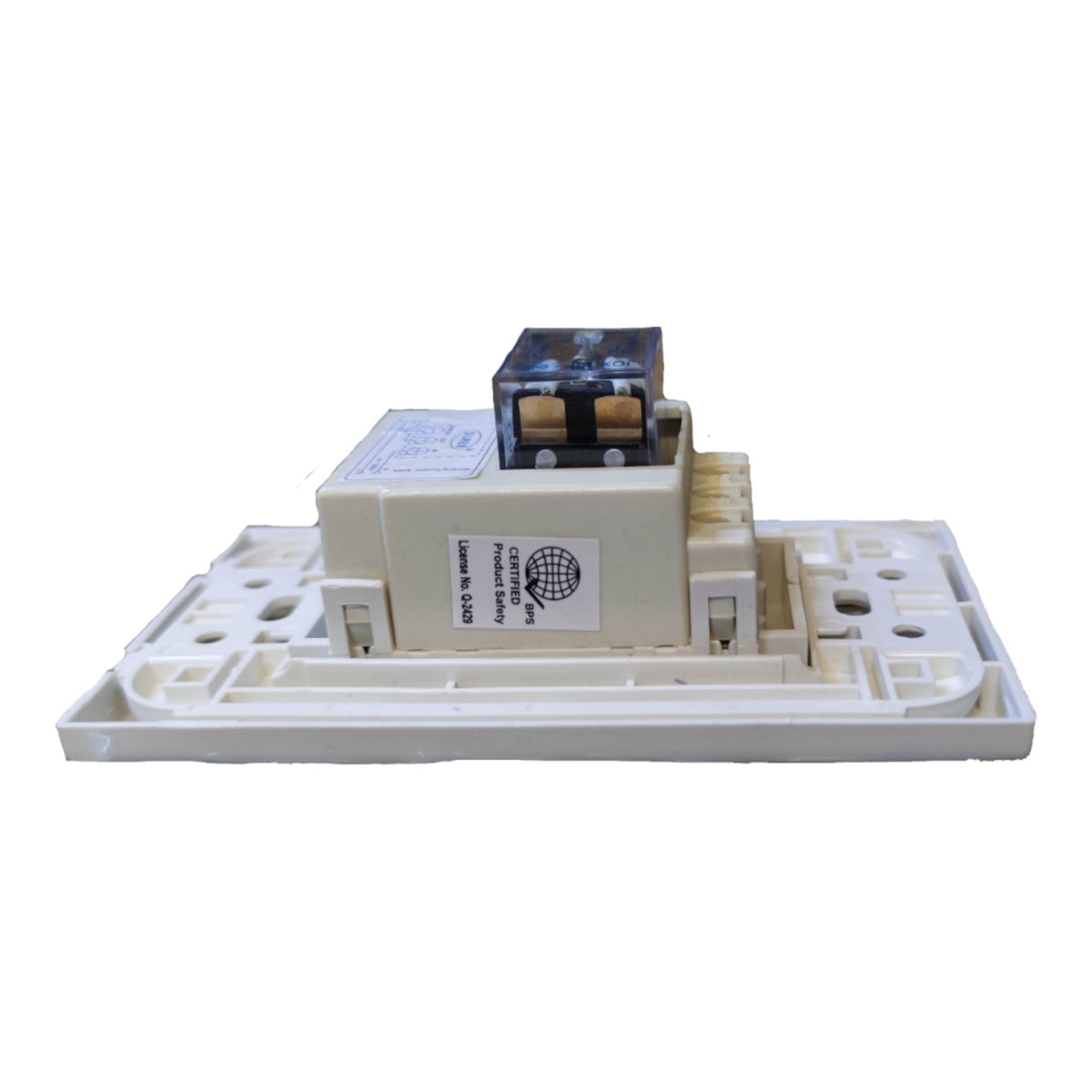 A white plastic electrical switch plate or socket cover with a central beige and black electronic component, isolated on a white background.