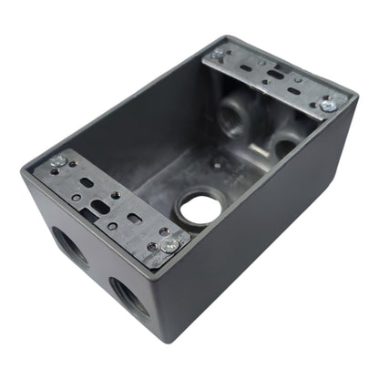 A dark gray metal electrical junction box with threaded connection ports and mounting brackets on the top, shown on a plain white background.