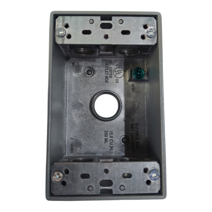 A gray metal electrical junction box with a central circular opening, pre-drilled screw holes, and printed technical specifications on the inner surface, isolated on a white background.
