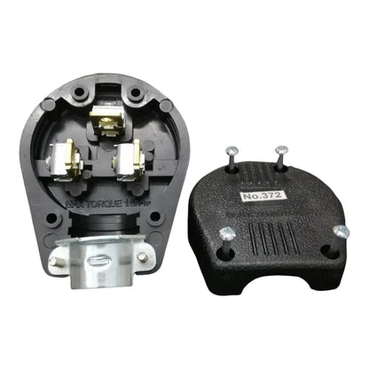 A black molded electrical plug housing or connector component shown from two angles on a plain white background. One view shows the interior terminals and metal contact points, and the other shows the exterior with mounting holes and a small label reading No.