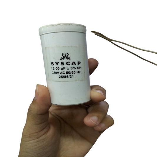 Syscap 12UF Motor Running Capacitor held in hand for electrical circuitry and motor applications