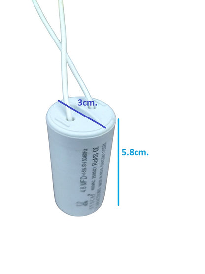 Syscap 450VAC capacitor for motors with white casing and wires for electrical circuitry