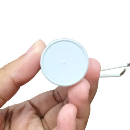 Syscap motor running capacitor 250v held in hand, perfect for electrical projects and repairs
