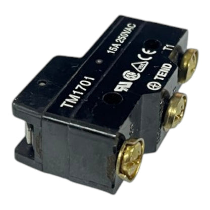 A small black electrical relay component with gold screw terminals and white printed text including 'TM1701', '15A 250VAC', and 'TEND' on a plain white background.