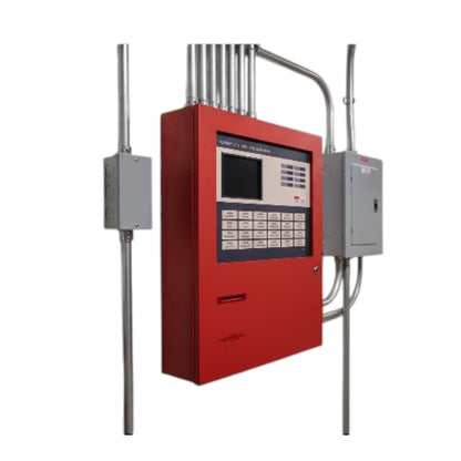 A red fire alarm control panel mounted on a metal frame with silver conduits, connected to gray electrical boxes on both sides, shown against a plain white background.