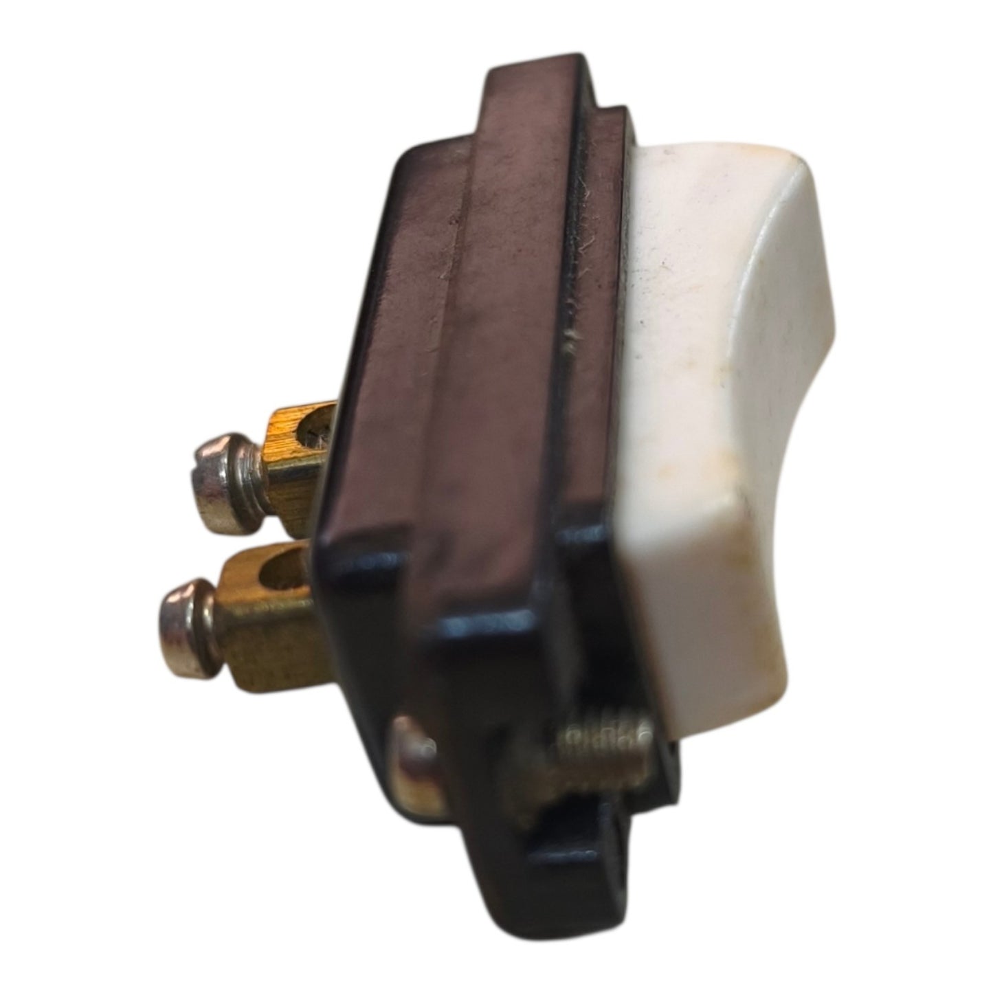 A small electrical switch component with a dark brown rectangular housing, a white curved toggle or lever, and brass-colored screw terminals, shown on a plain white background.