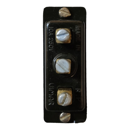 A vintage black electrical switch panel with three screw terminals and brass-colored metal screws, featuring embossed text including '10A 250V' and 'OLYMAR'.