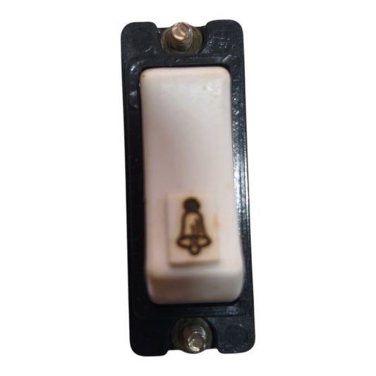 A single-button push-to-call or alarm switch with a white ceramic button and a black plastic housing, featuring a small printed bell icon on the button face.
