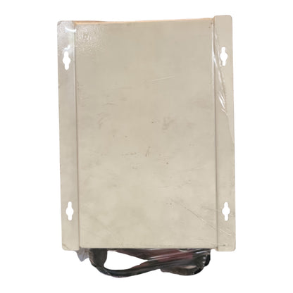 A rectangular beige metal electronic control box or panel with mounting holes on the sides, wrapped in protective plastic film, with black and red wires visible at the bottom, set against a plain white background.