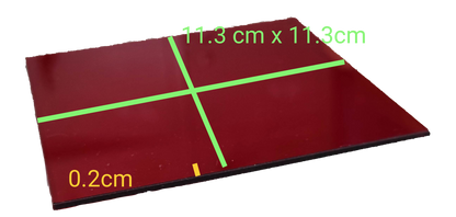 Acrylic red light filter sheet measuring 11.3 cm x 11.3 cm with a thickness of 0.2 cm