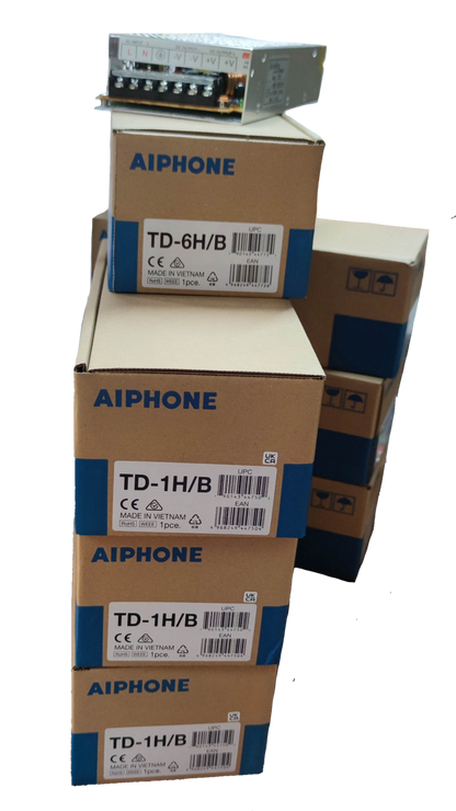 Aiphone 6 station intercom system boxes stacked with electronic component on top for security setup