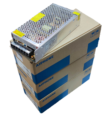 Aiphone intercom system power supply unit on stacked Aiphone branded boxes for CCTV and security system