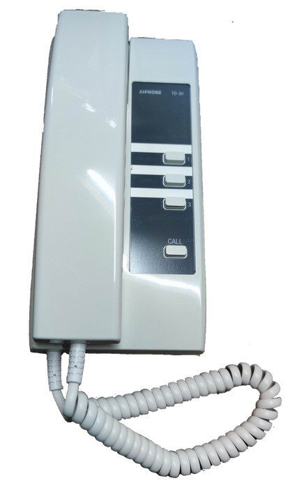 White Aiphone intercom system with handset and call buttons for secure communication