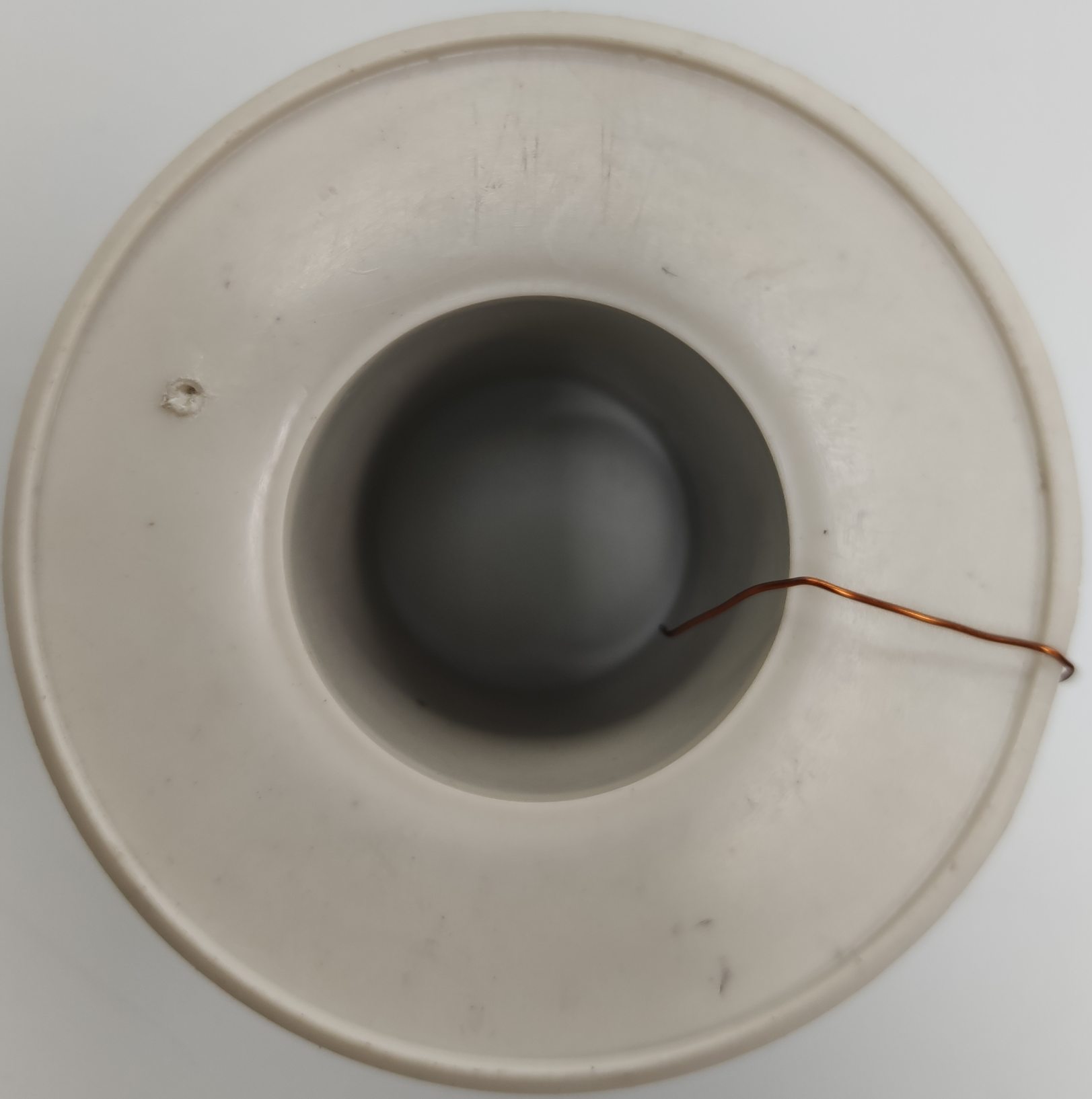 Philflex AWG 43 magnet wire spool with thin copper wire neatly wound on a white plastic reel