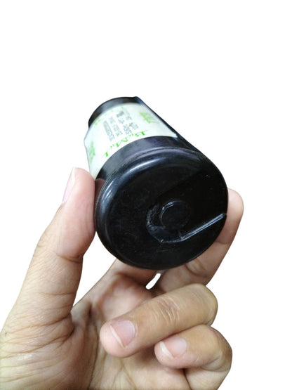 BMI Starting capacitor 250-300UF 165V held in hand showing the bottom design and label details