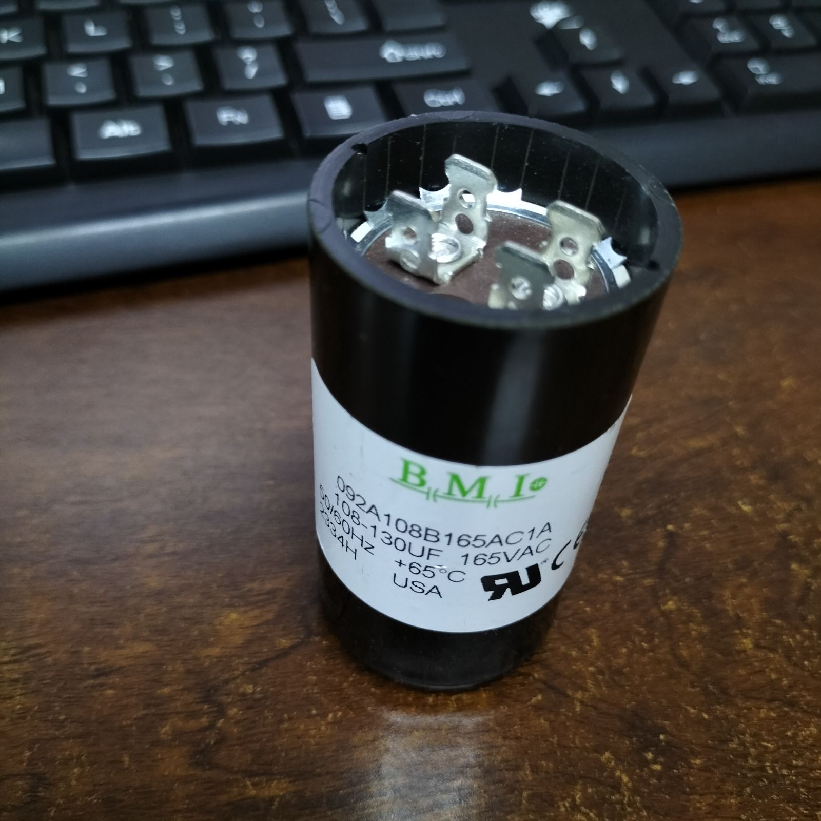 BMI 108-130mfd capacitor 165v with metal terminals and black casing for electrical applications