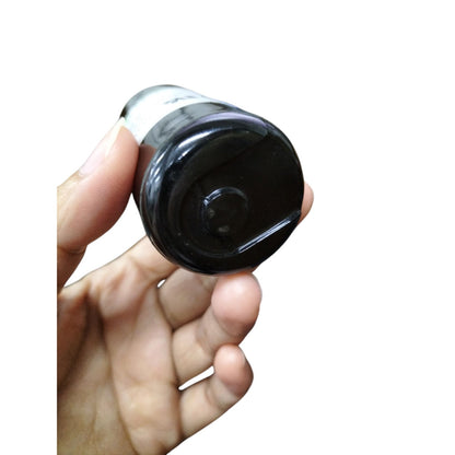 BMI 216-259MFD AC capacitor 250V held in hand showing top view and design details