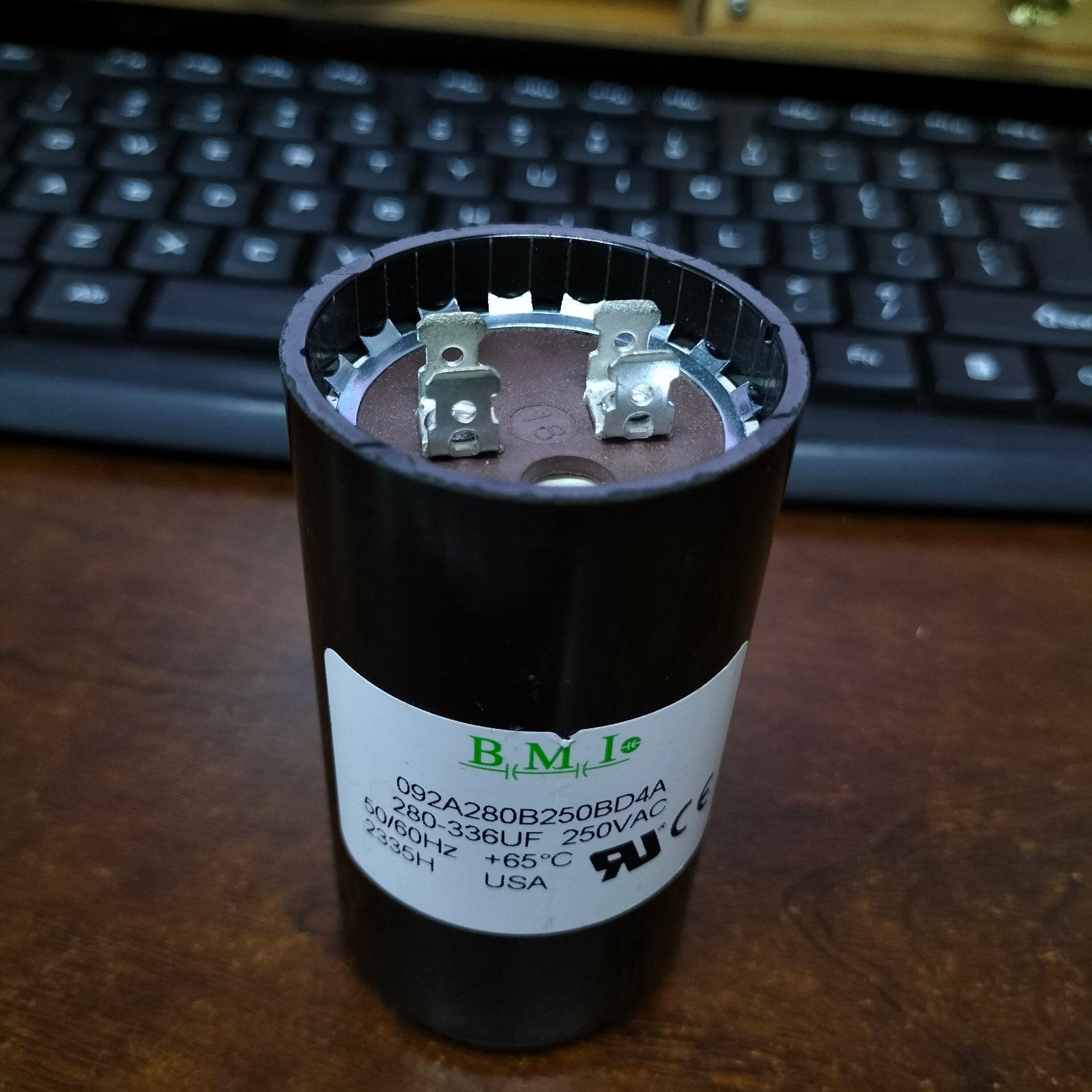 BMI 280-366UF 250V AC start capacitor with metal terminals and protective casing