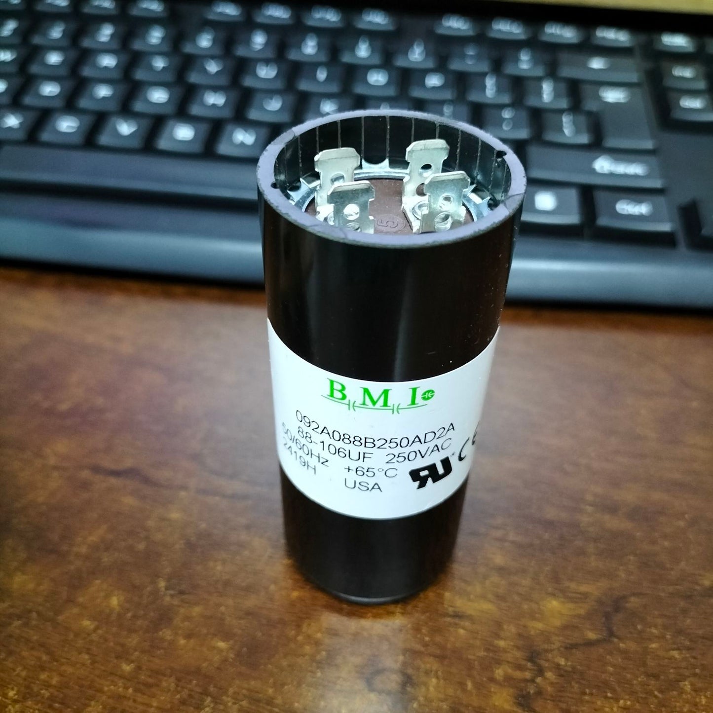BMI 88-106MFD 250V AC capacitor with a cylindrical design for electrical circuitry applications
