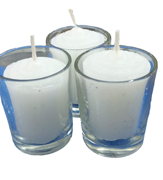 Set of three candle with glass white holders filled with white wax and unlit wicks