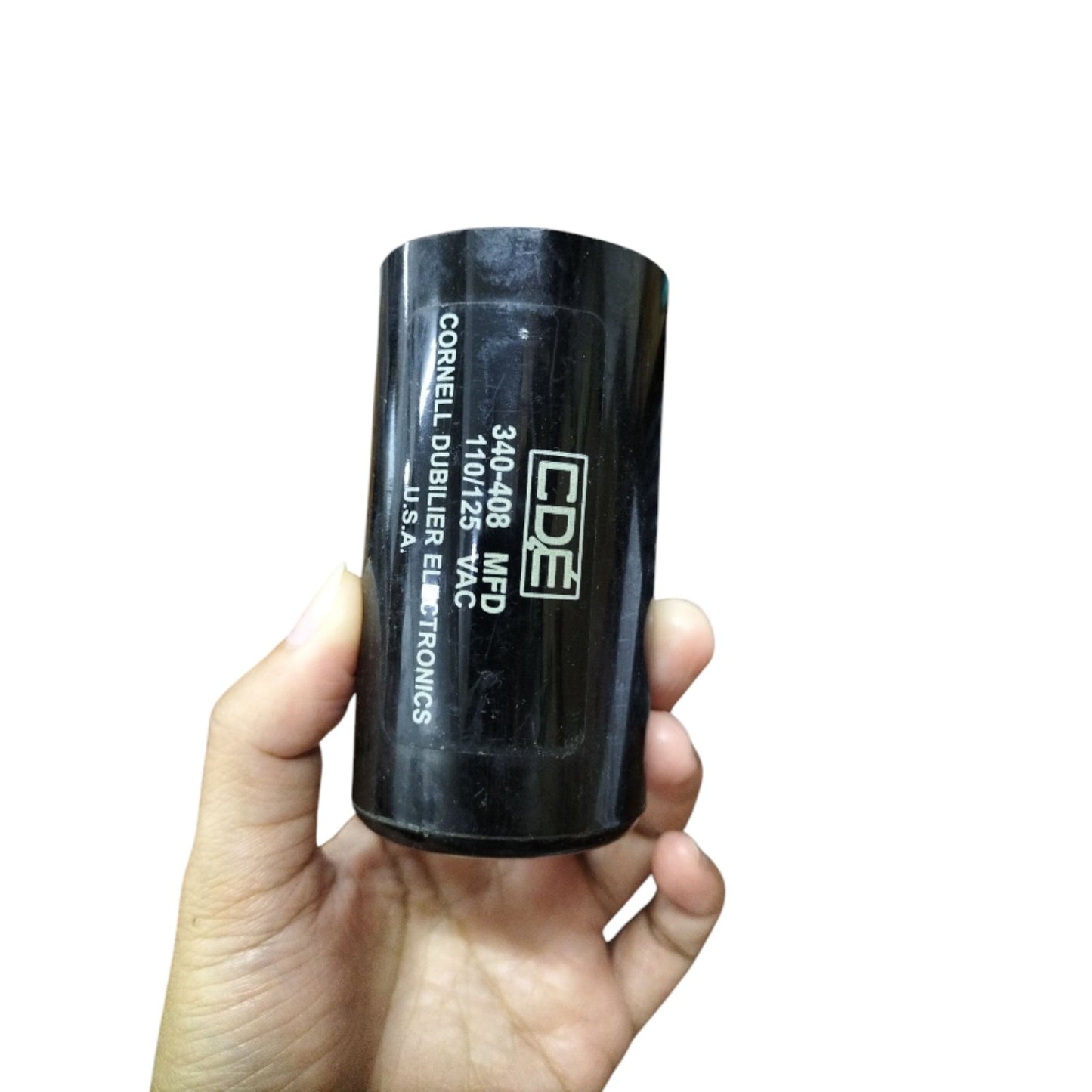 CDE Motor Starting Capacitor 340-408MFD held in hand, suitable for electrical applications