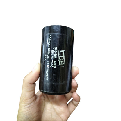 CDE Motor Starting Capacitor 340-408MFD held in hand, suitable for electrical applications