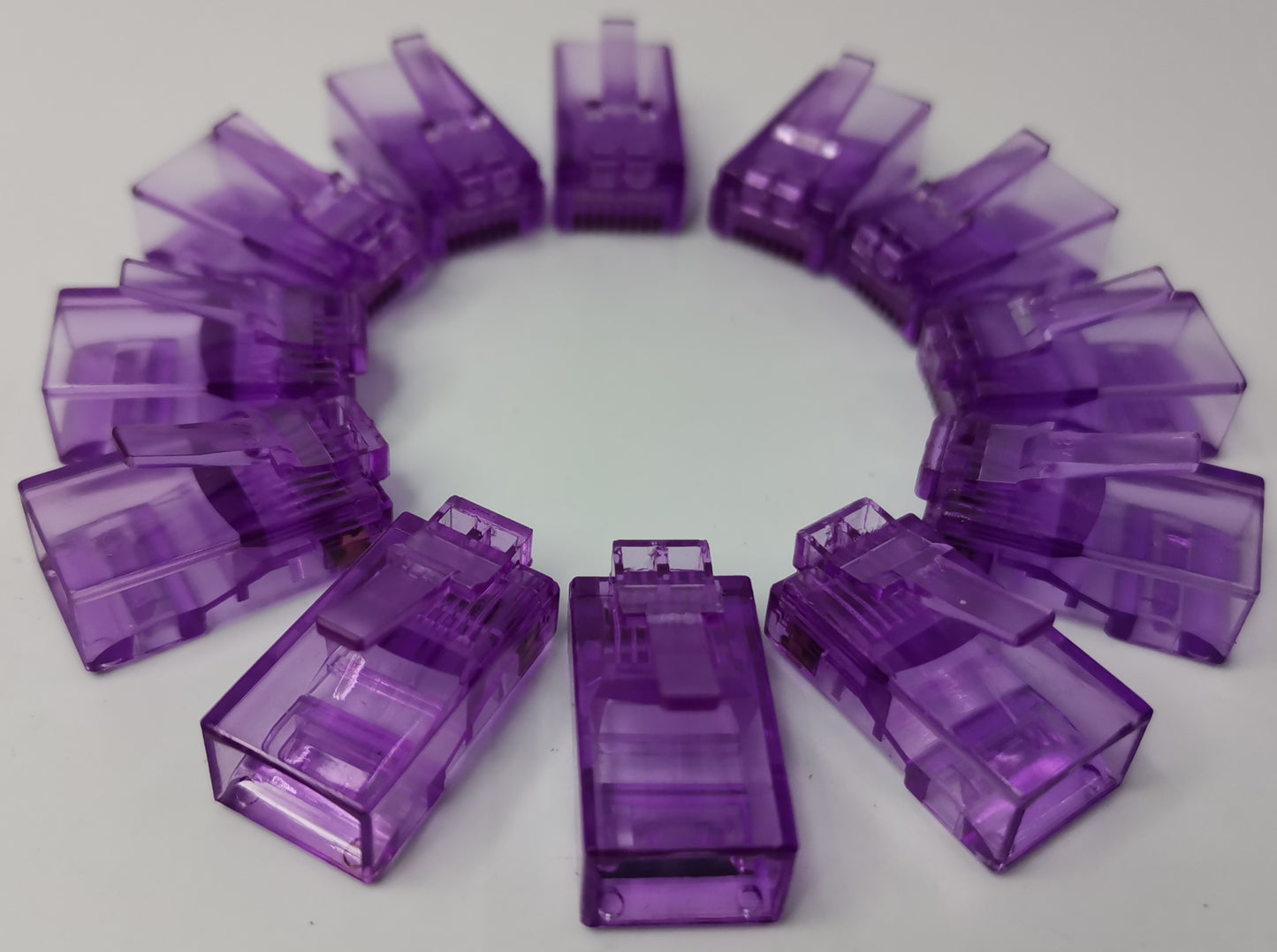 Grippes powerline network adapter featuring multiple Denko RJ45 Connector colored in purple arranged in a circle