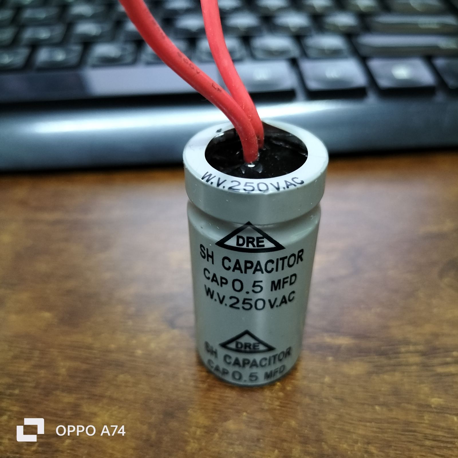DRE 0.5MFD Motor Running Capacitor with 250V AC rating and red wires for electrical circuitry