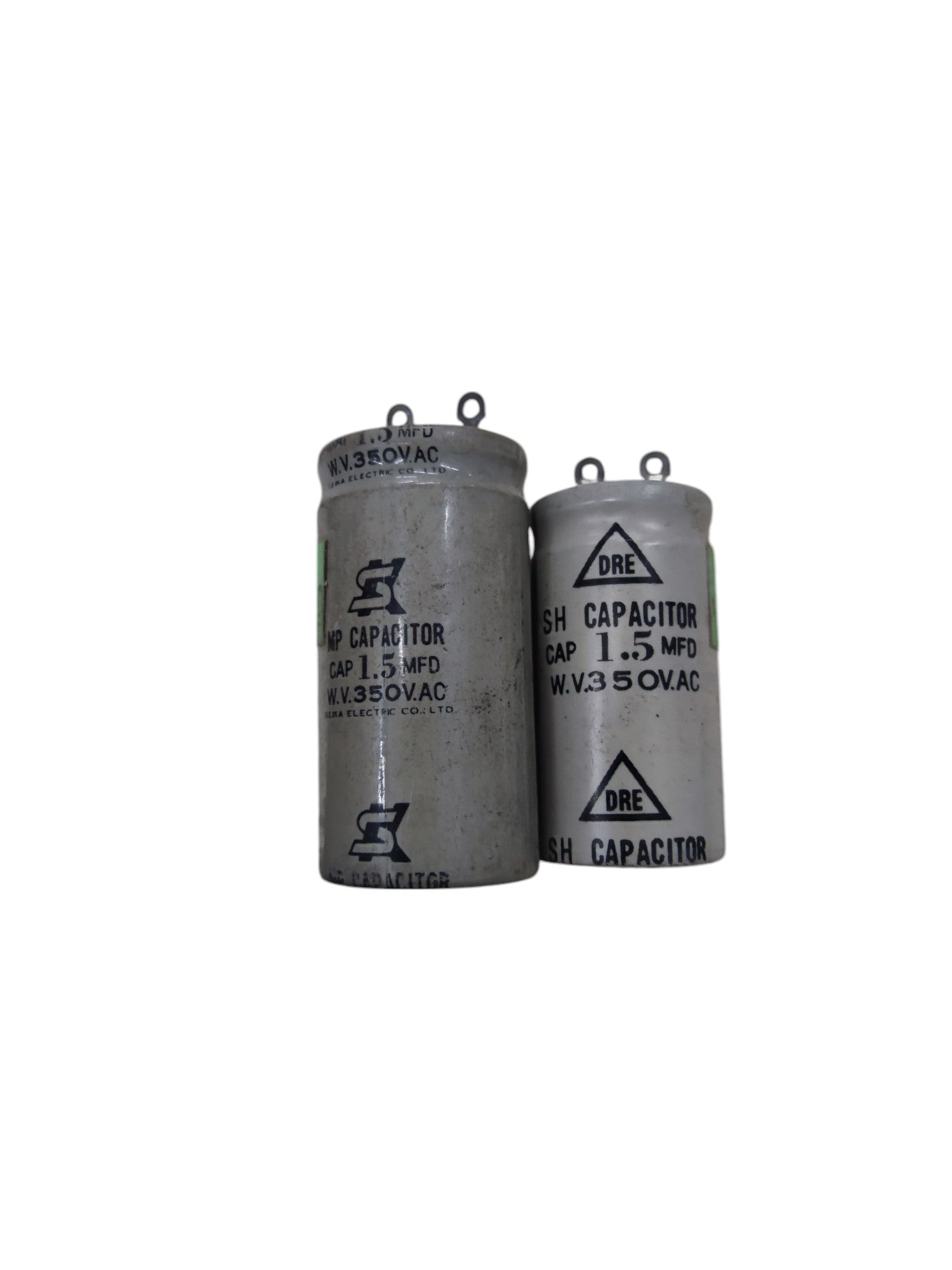 Two electrical capacitors labeled 1.5 MFD and 350V running capacitor 1MFD for circuit applications