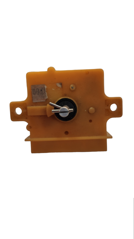 Yellow plastic washing machine timer part with central metal dial for laundry appliance repair