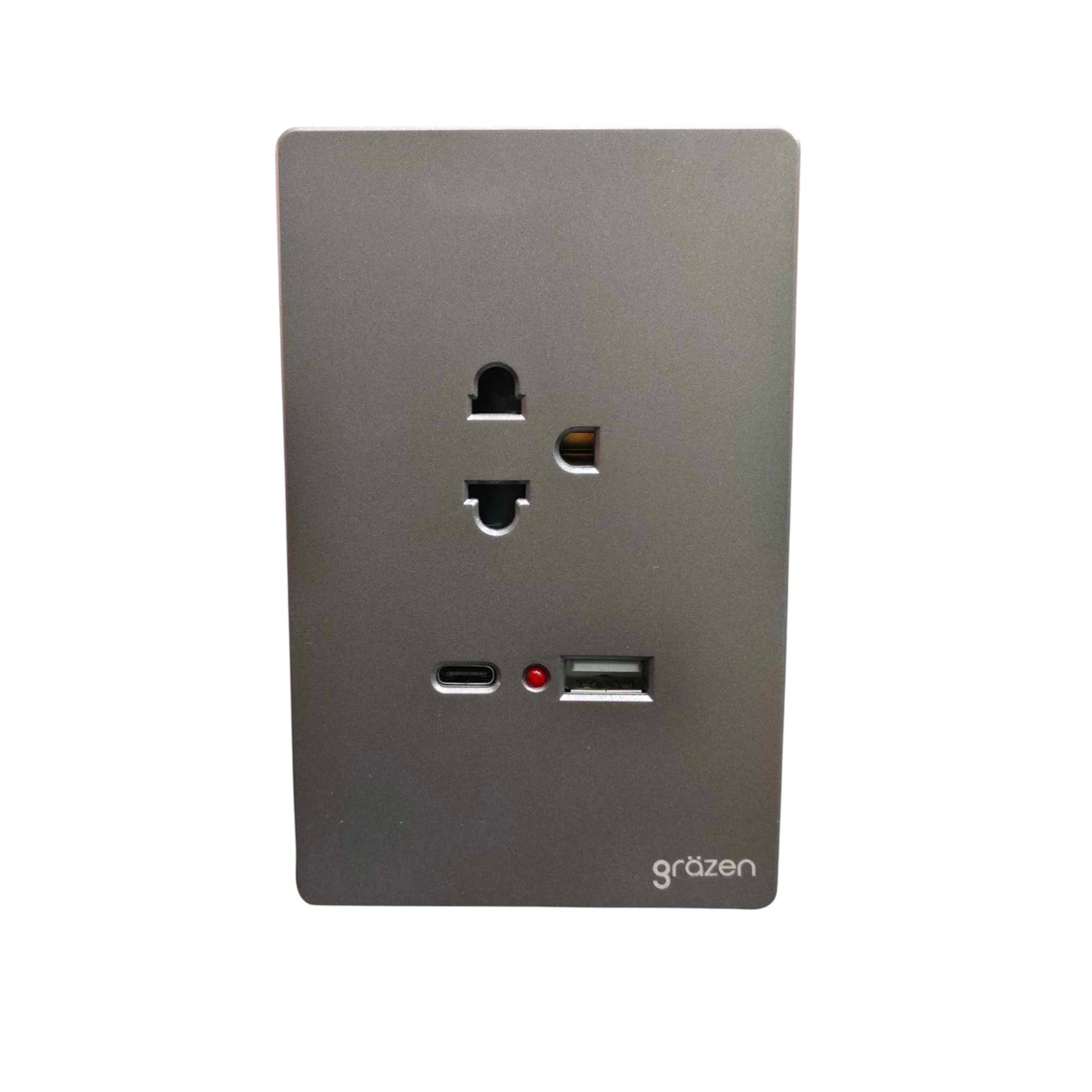 A modern wall-mounted dual USB-C charging outlet with a US outlet socket and two USB-C ports on a matte dark gray panel, branded 'grézen'.
