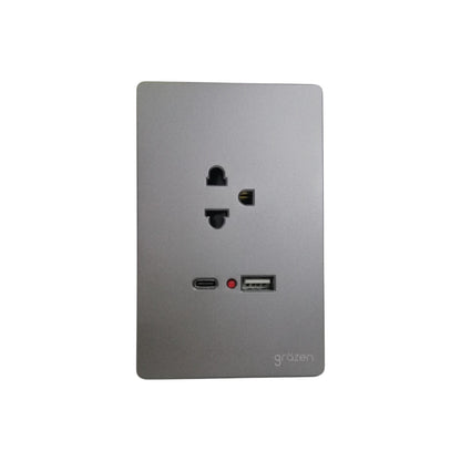 A square silver-gray wall outlet cover plate featuring a US outlet, a USB-C port, a USB-A port, a small red indicator light, and the 'gräben' brand logo in the bottom right corner, shown on a plain white background.