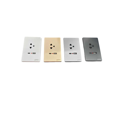 Four rectangular wall outlets in different finishes (white, gold, silver, and dark gray) arranged in a row on a plain white background.
