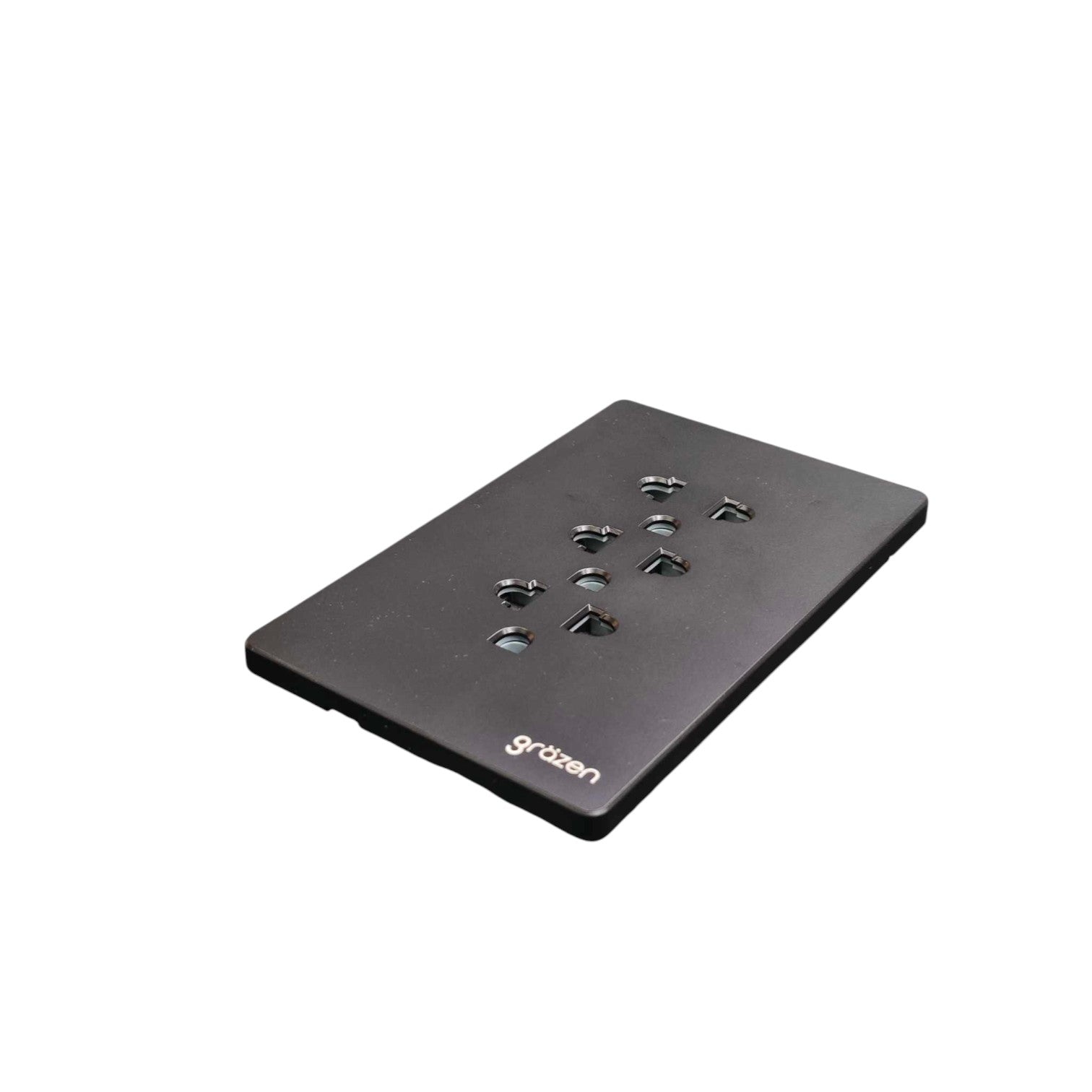 A black rectangular mounting plate with multiple screw holes and the 'grzben' brand name printed in white near the bottom edge, shown on a plain white background.