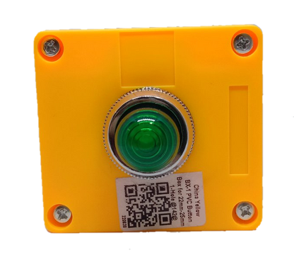 Auspicious green pilot lamp with enclosure mounted on a yellow square plastic box with screws
