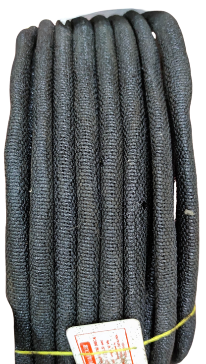 Coil of black braided mica electrical insulation tubing for high temperature wire protection