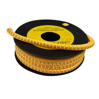Yellow spiral cable management sleeve for organizing wires on a black spool